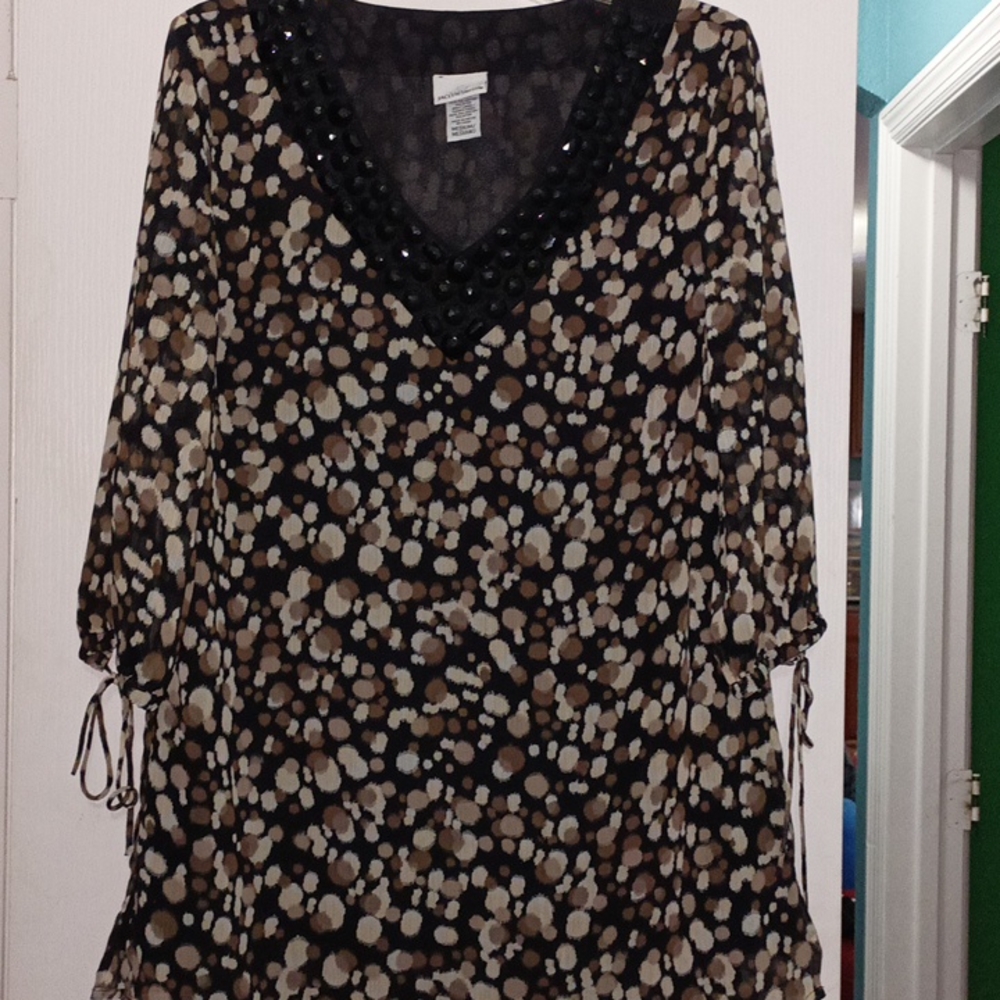 Beautiful women's blouse with beaded neckline